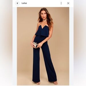Lulus Classic and sexy strapless navy jumpsuit.
